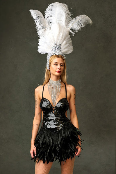 Black burlesque dress with white headdress for hire