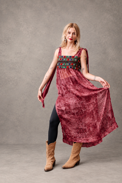 Editorial view of burgundy hand-embroidered chiffon boho dress - Zoe London Wearable Art Collection