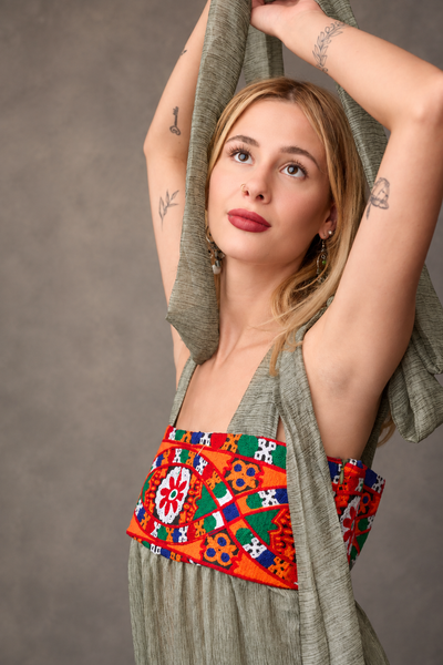 Model wearing olive hand-embroidered chiffon boho dress - Zoe London Wearable Art Collection